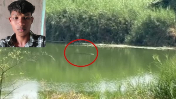 A YOUNG MAN DRAGGED CROCODILE